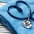 Blue stethoscope shaped like a heart on medical scrubs.
